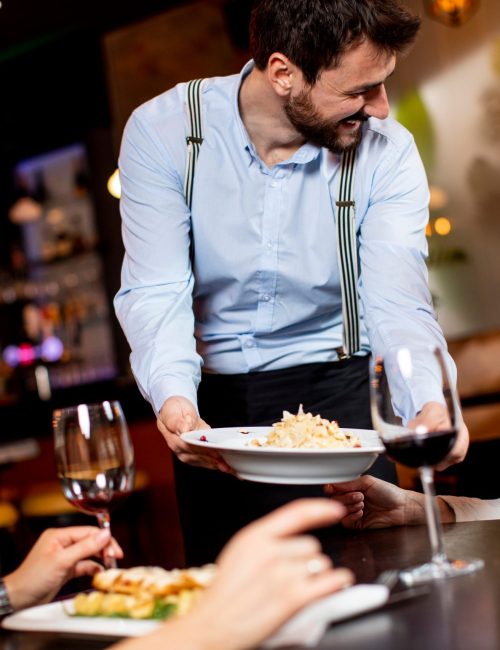 Handsome,Young,Waiter,Serving,Food,To,Female,Customers,In,The Handsome,Young,Waiter,Serving,Food,To,Female,Customers,In,The