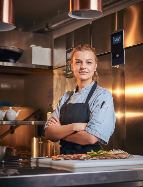 Confident,And,Serious,Female,Chef,Standing,With,Hands,Crossed,In Confident,And,Serious,Female,Chef,Standing,With,Hands,Crossed,In